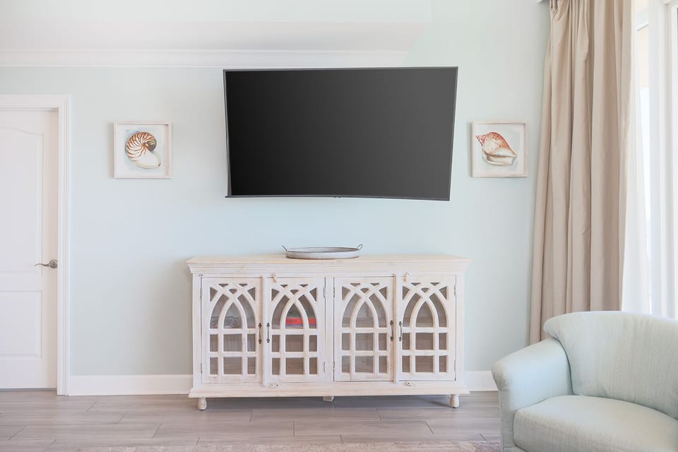 Gather in this inviting living space, where you can stream your favorite shows while enjoying the coastal vibe
