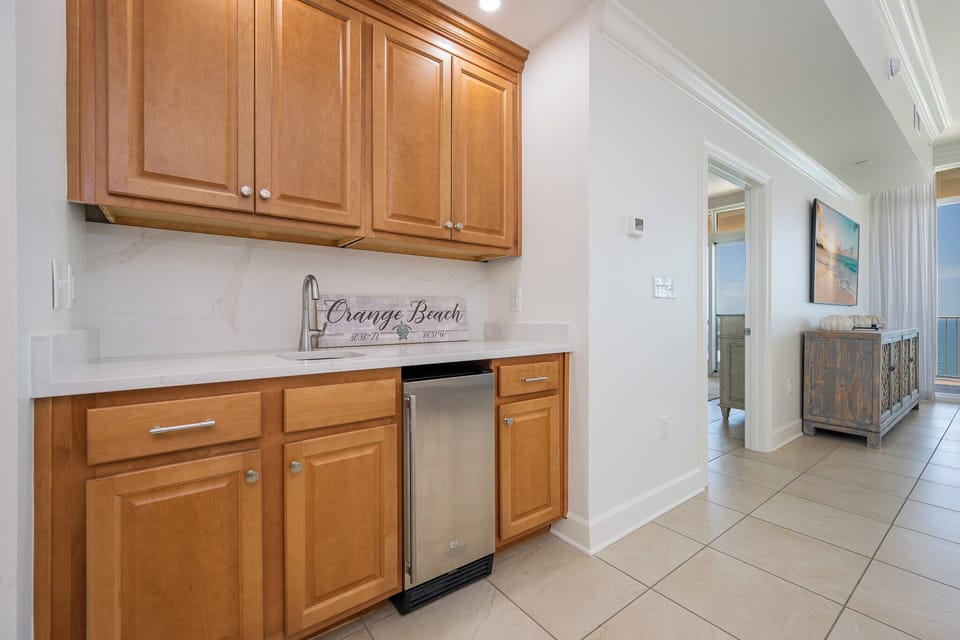 Imagine yourself preparing cool drinks in this wet bar just steps from stunning balcony views