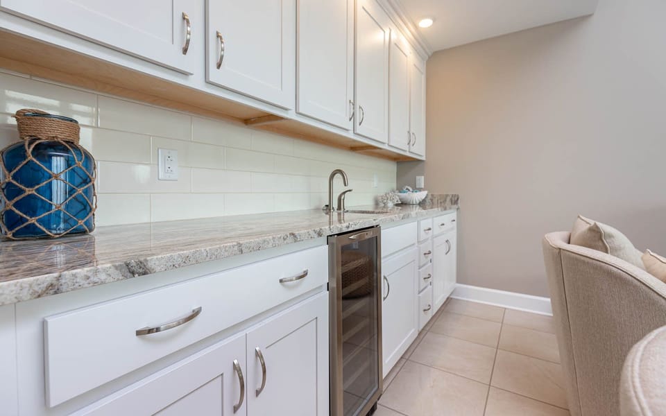 Indulge in a refreshing drink from the wet bar while enjoying the comfortable seating and inviting atmosphere