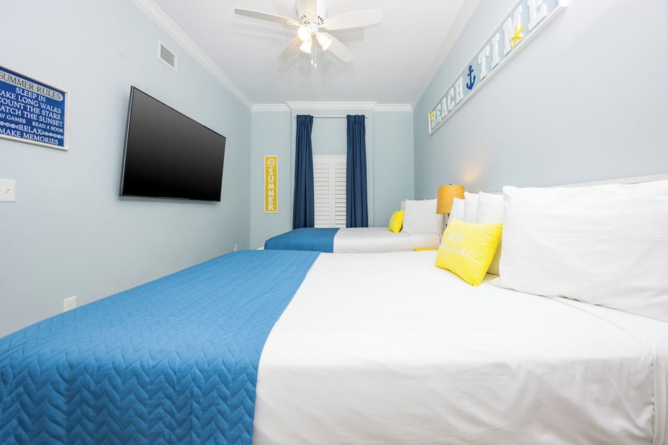 Drift into restful nights in this queen guest room as soothing coastal vibes invite you to relax and recharge in comfort