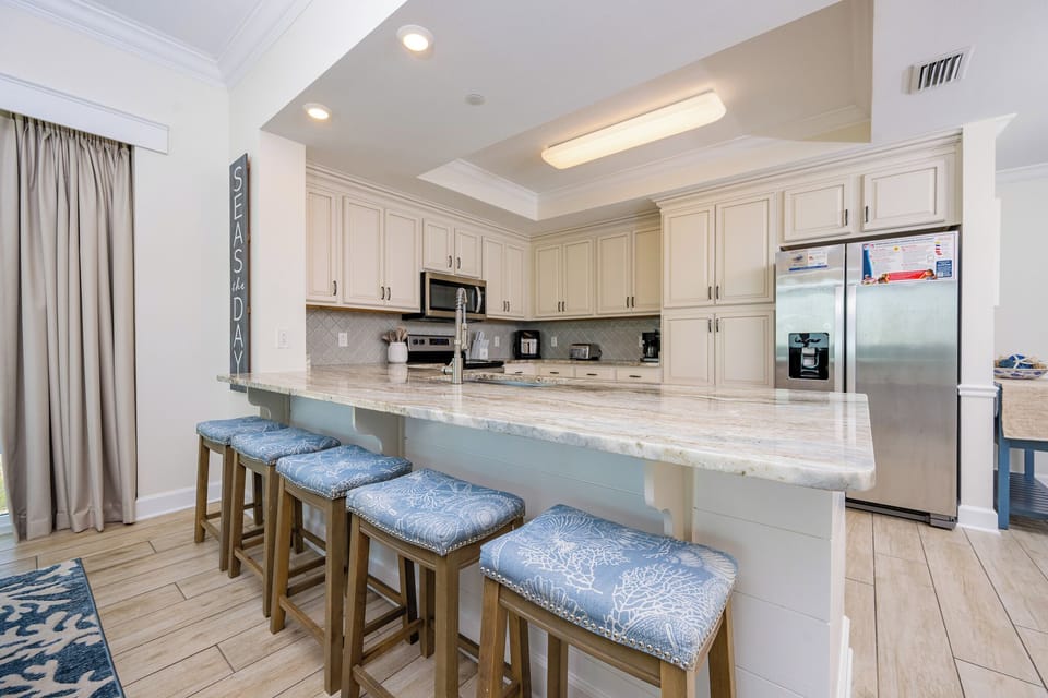 Savor coffee at the inviting breakfast bar, where you can chat and plan your beach adventures ahead