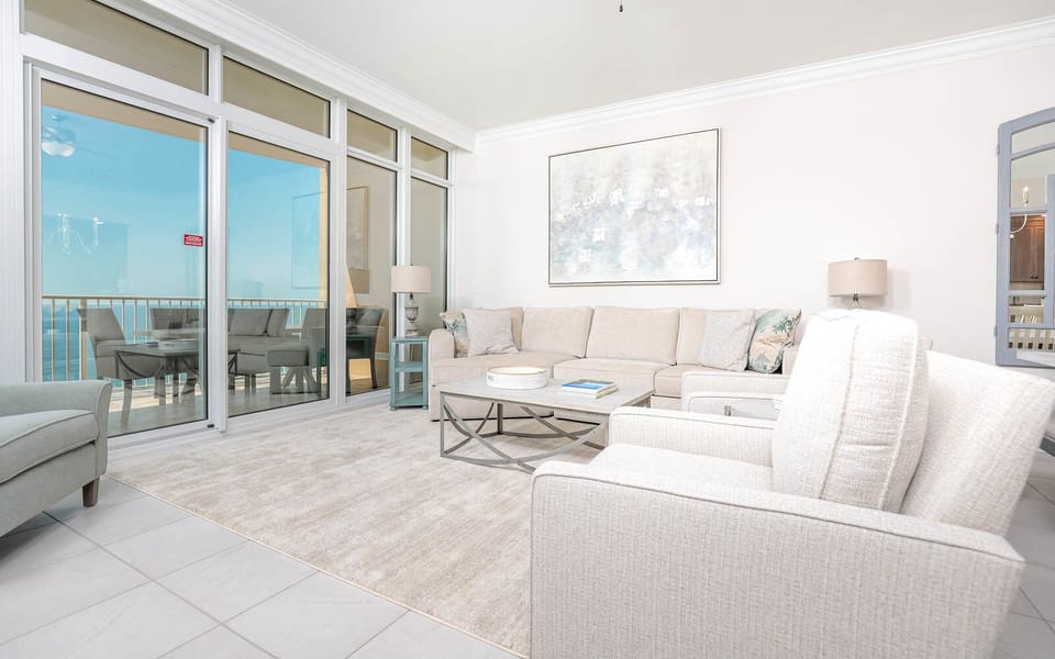 Relax on the cozy sofa with a queen sleeper in this inviting family room with breathtaking beachfront views