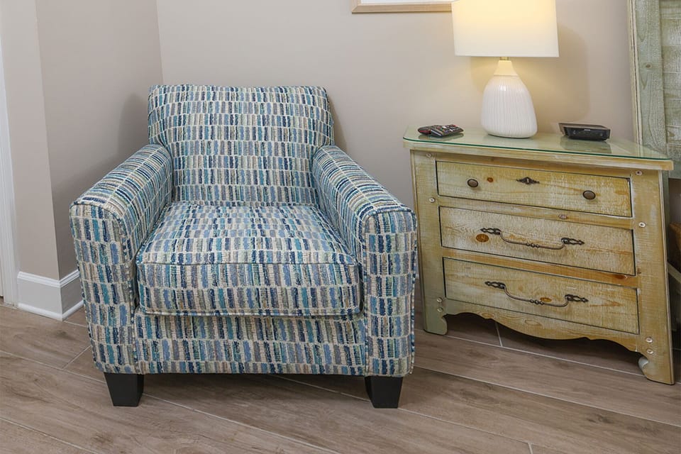 Curl up in a stylish chair, sipping coffee while basking in the warm glow from a nearby lamp