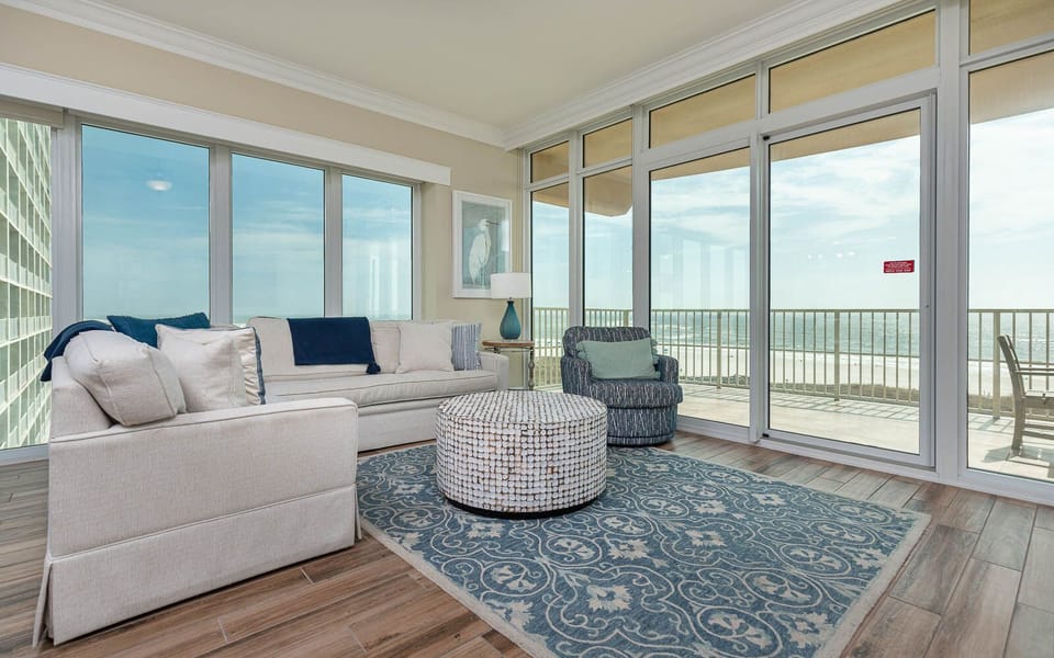Unwind in the living area, featuring a queen sofa sleeper, soaking in the panoramic coastal views