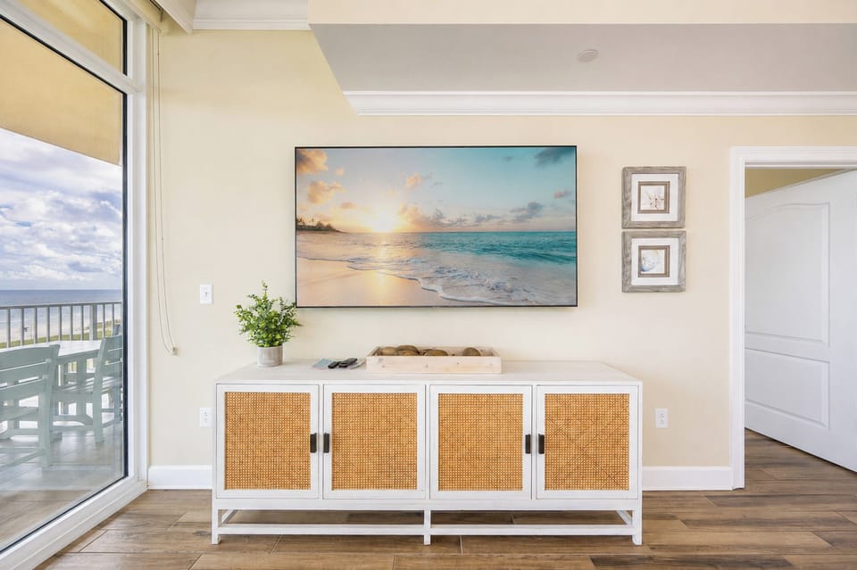 Experience relaxation in the cozy living space, enjoying your favorite shows while catching coastal breezes