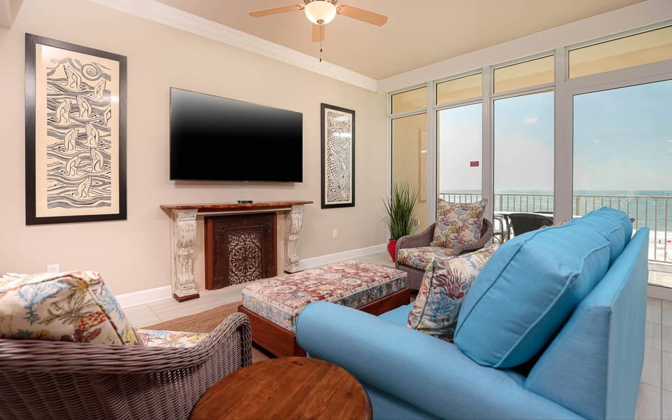 Experience relaxation in the cozy living area, featuring a queen sofa sleeper and gorgeous views of the beach