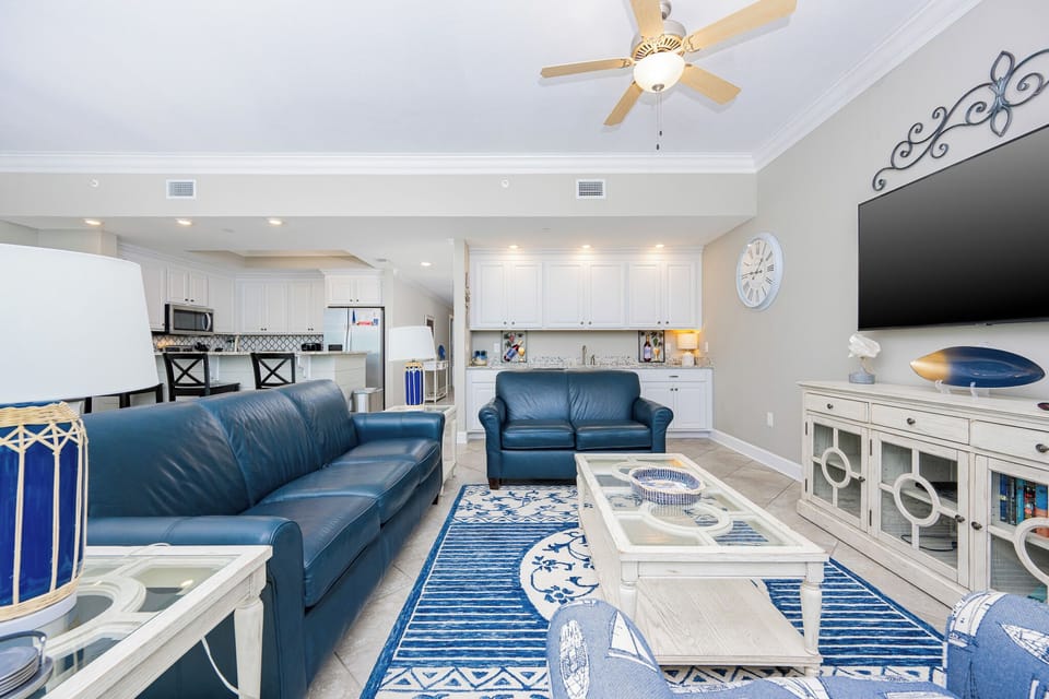 Relax on the plush couch, sharing stories and laughter as you enjoy the coastal charm of your inviting living area