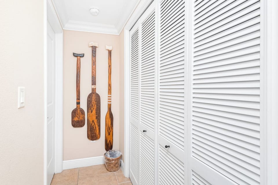 Your private hallway features coastal-inspired décor with handcrafted paddle art