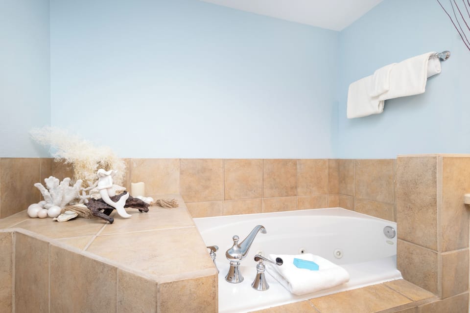 Sink into your private spa sanctuary with elegant tiling, thoughtful amenities, and plush towels awaiting your arrival.