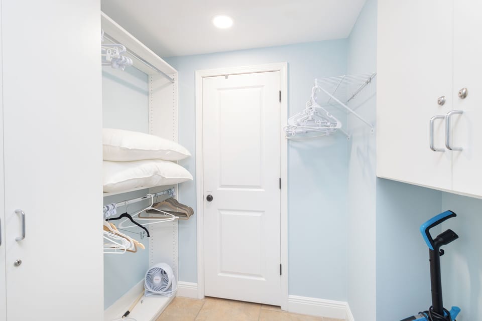 Your private laundry room keeps you organized with smart storage, hanging space, and modern appliances for hassle-free stays.