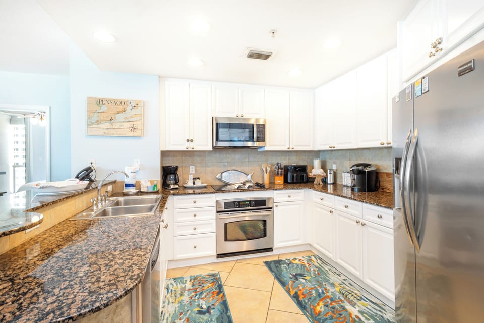 Your fully equipped kitchen features granite counters, stainless steel appliances, and everything you need to cook memorable meals during your stay.