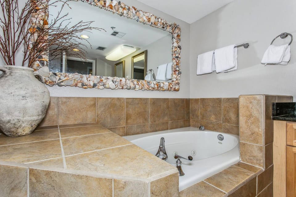 Slip into your private soaking tub and let warm water ease away the day, surrounded by coastal charm and plush towels waiting just for you.