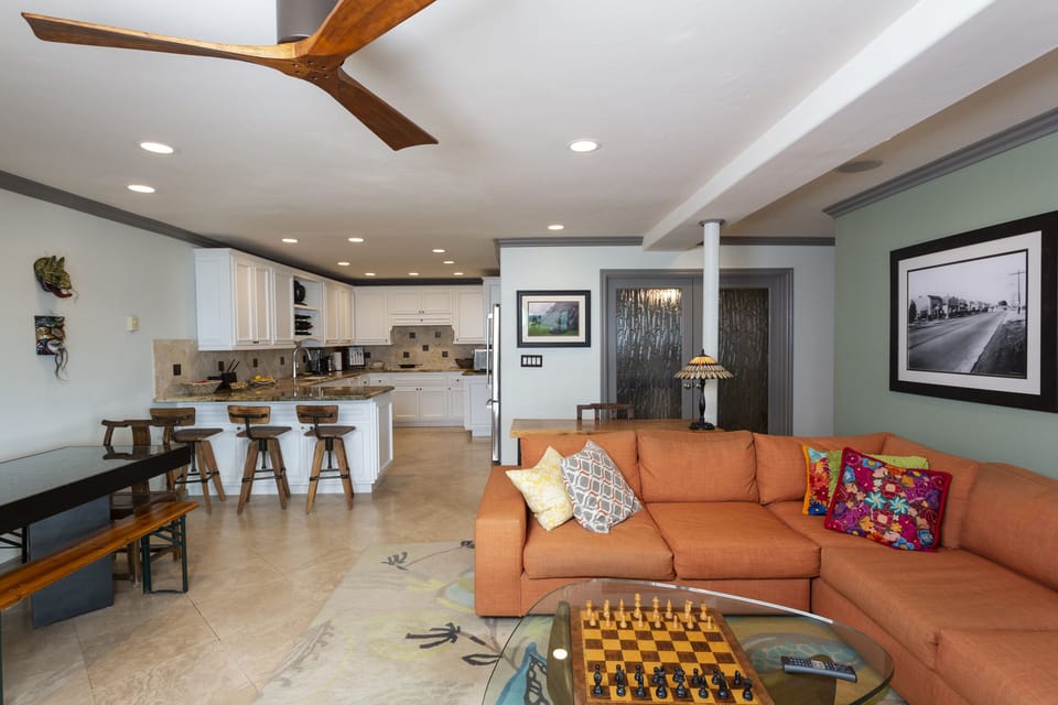 The living room has plenty of seating to gather with the family.