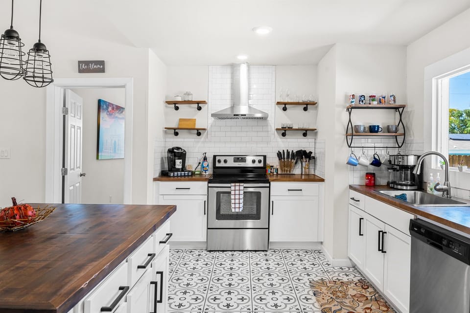 The modern kitchen is well stocked to provide anything you might need to cook a delicious meal, finished with stainless steel appliances.