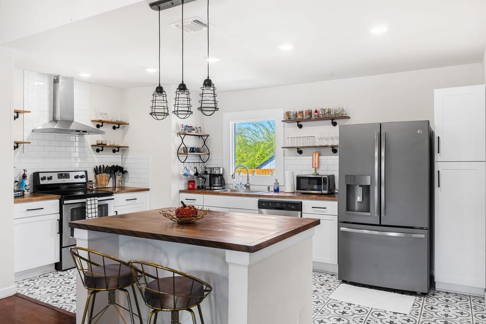 The modern kitchen is well stocked to provide anything you might need to cook a delicious meal, finished with stainless steel appliances.