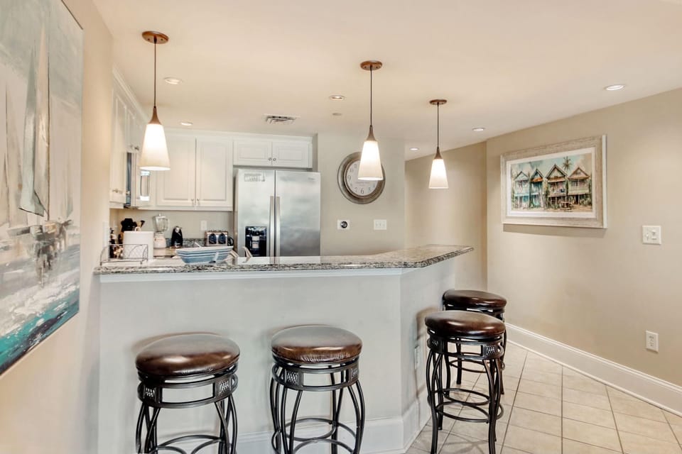 Bright, open kitchen with breakfast bar and modern amenities