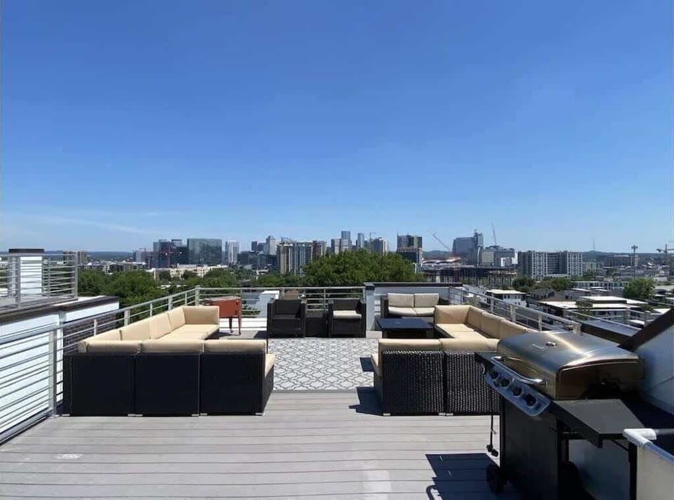 Escape to your private rooftop oasis with stunning city views and luxe lounge seating.