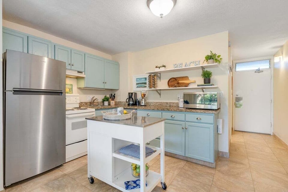 Convenient entryway leading directly into the heart of the studio, featuring plenty of storage and sleek cabinetry.