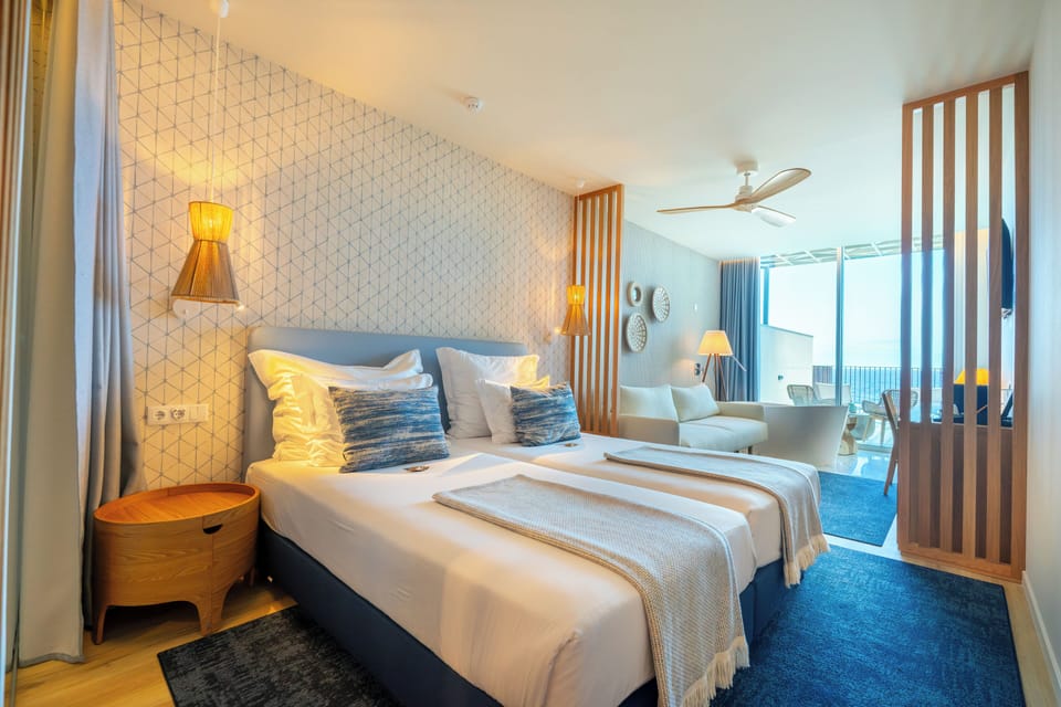 Suite, Sea View | Free minibar items, in-room safe, individually decorated