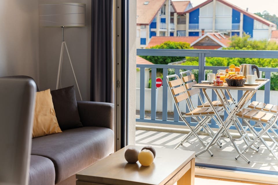 Comfortable seating area. Unit may feature furnished balcony or patio. Views vary.