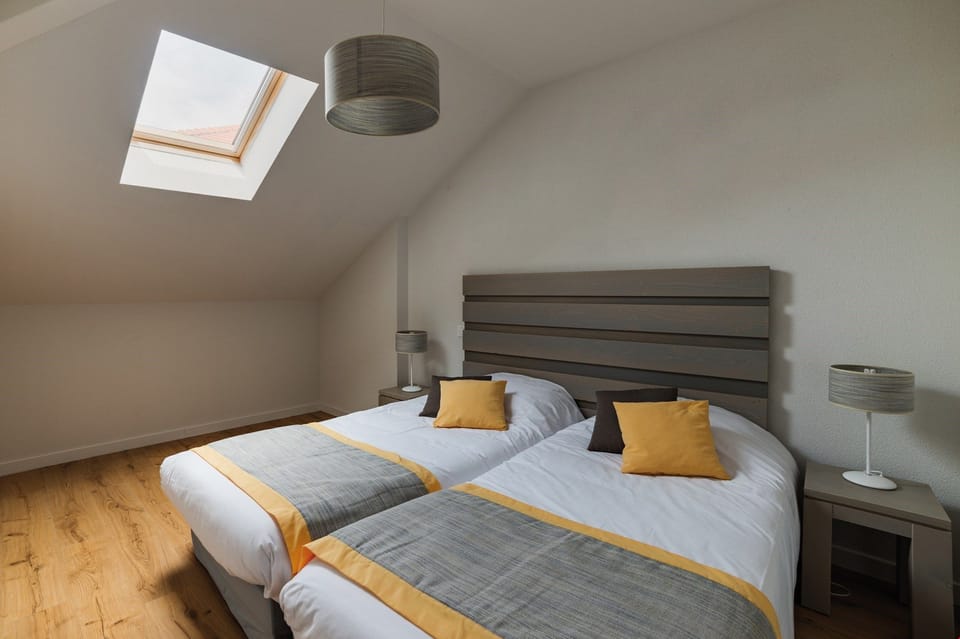 Get a peaceful night sleep in our cozy bedroom. Bedding configurations vary!