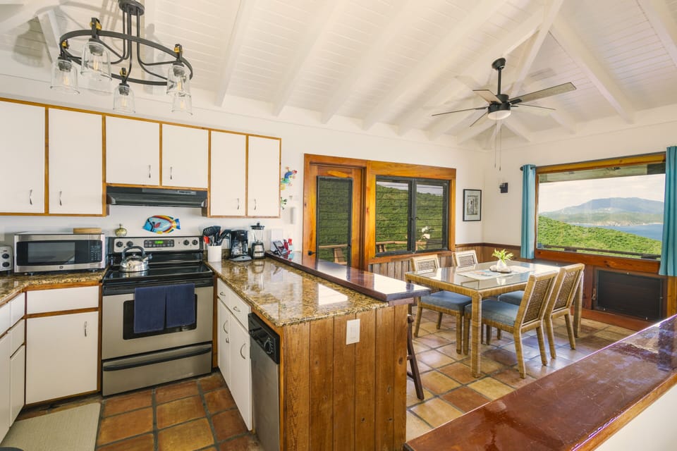 The Kitchen has everything you need. Bar seating for 2 and a dining table for 4.