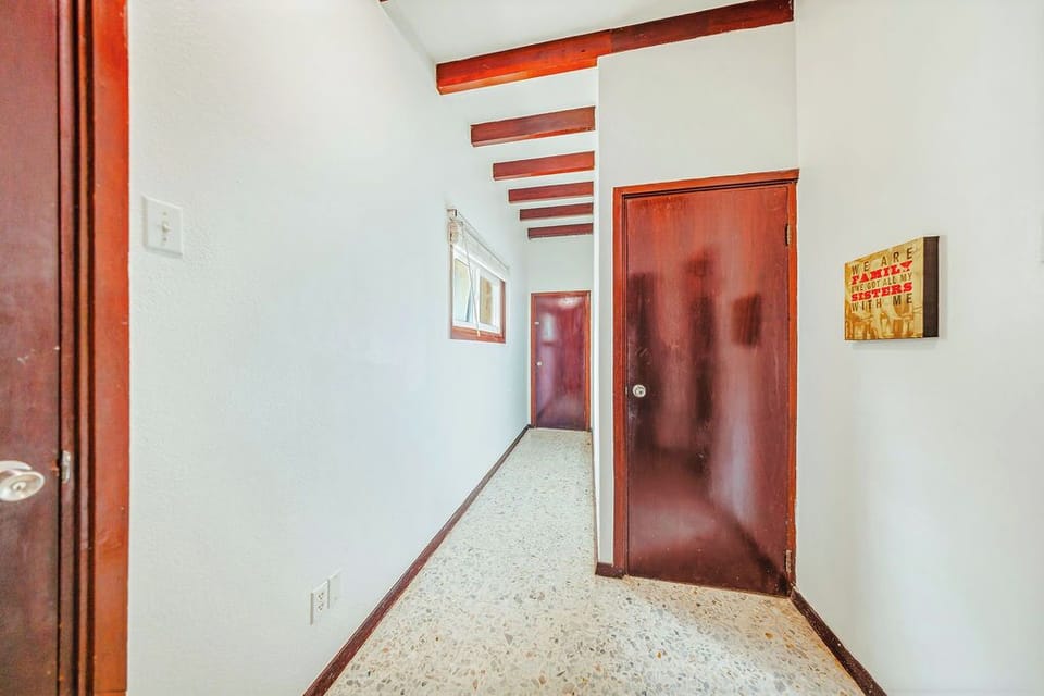 The hallway leads to the bedroom