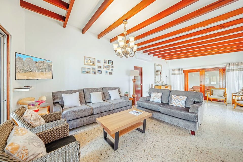 Our main room offers the perfect blend of comfort and entertainment. Kick back on one of the plush sofas, catch a game or movie on the mounted flat-screen TV, or simply enjoy the beautiful natural light. It’s relaxation made easy.