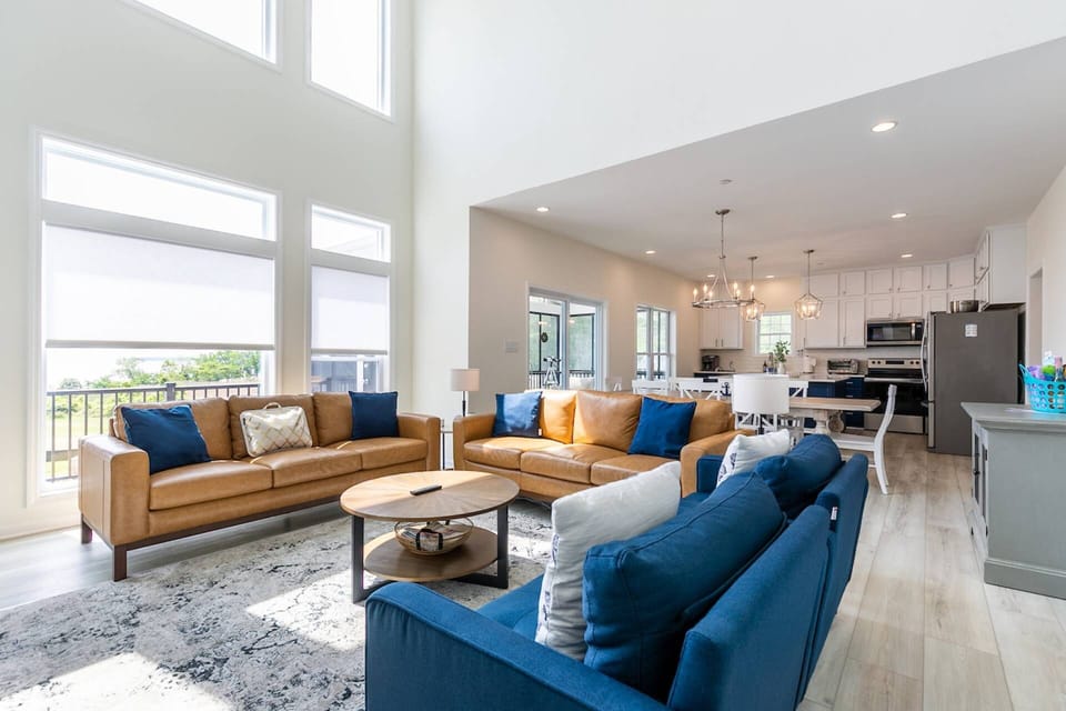 The 2-story great room in opens up to the dining room and kitchen.
