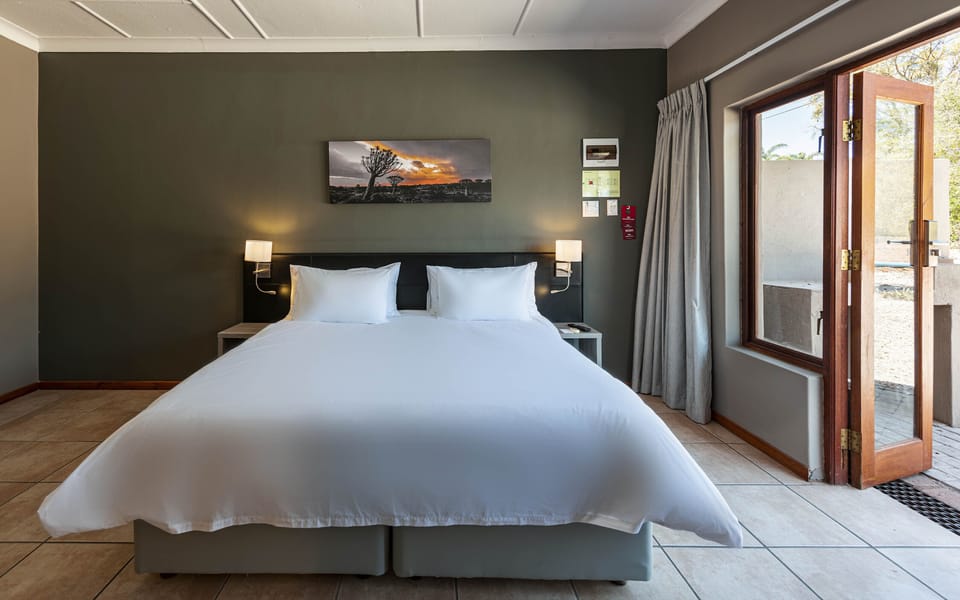 Standard Room | In-room safe, desk, laptop workspace, blackout drapes