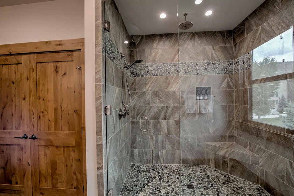 Master Bathroom with walk in Shower and bench