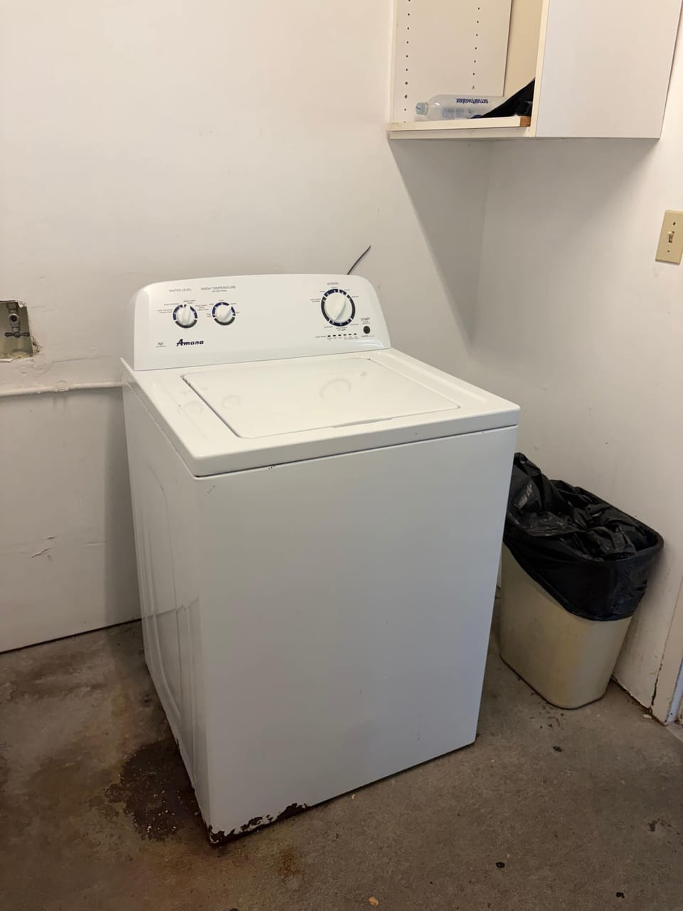 complimentary washer in garage laundry room