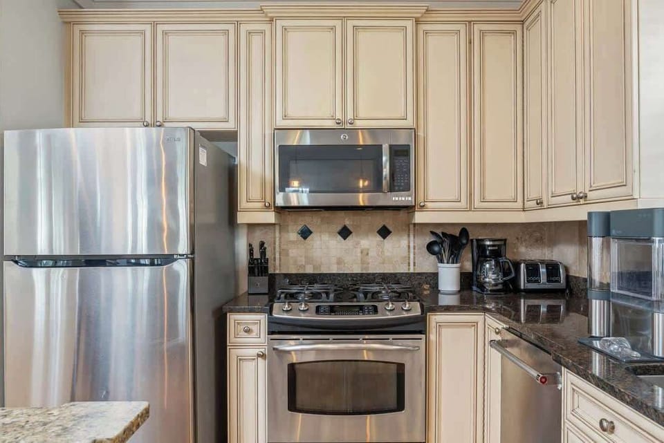 Our kitchen is fully stocked with dishes, silverware, utensils, cookware, bakeware, and a variety of small appliances.
