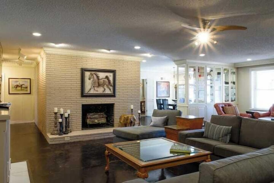The living room has plenty of comfy seating for the whole gang to gather.