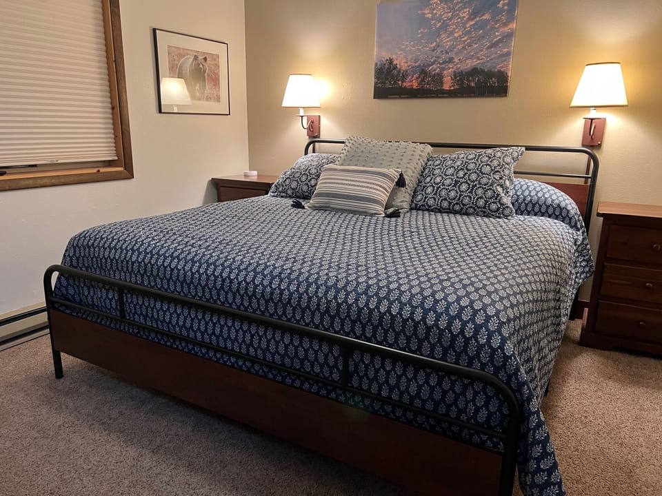 Master bedroom with king bed and full bathroom
