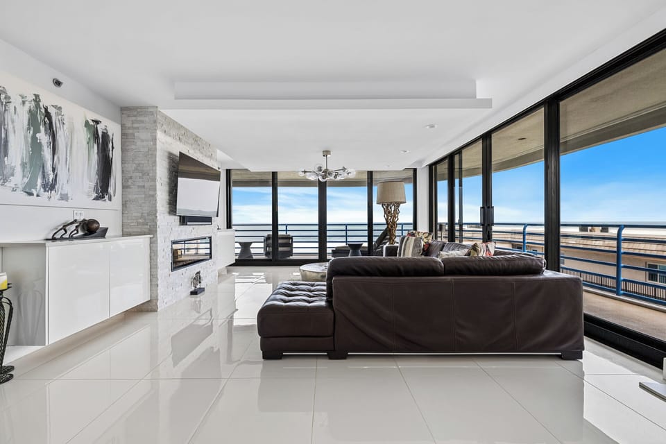 Spacious living room area with access to the balcony.
