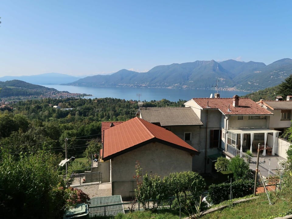Sky, Plant, Property, Water, Mountain, Building, Tree, Highland, Natural Landscape, Land Lot