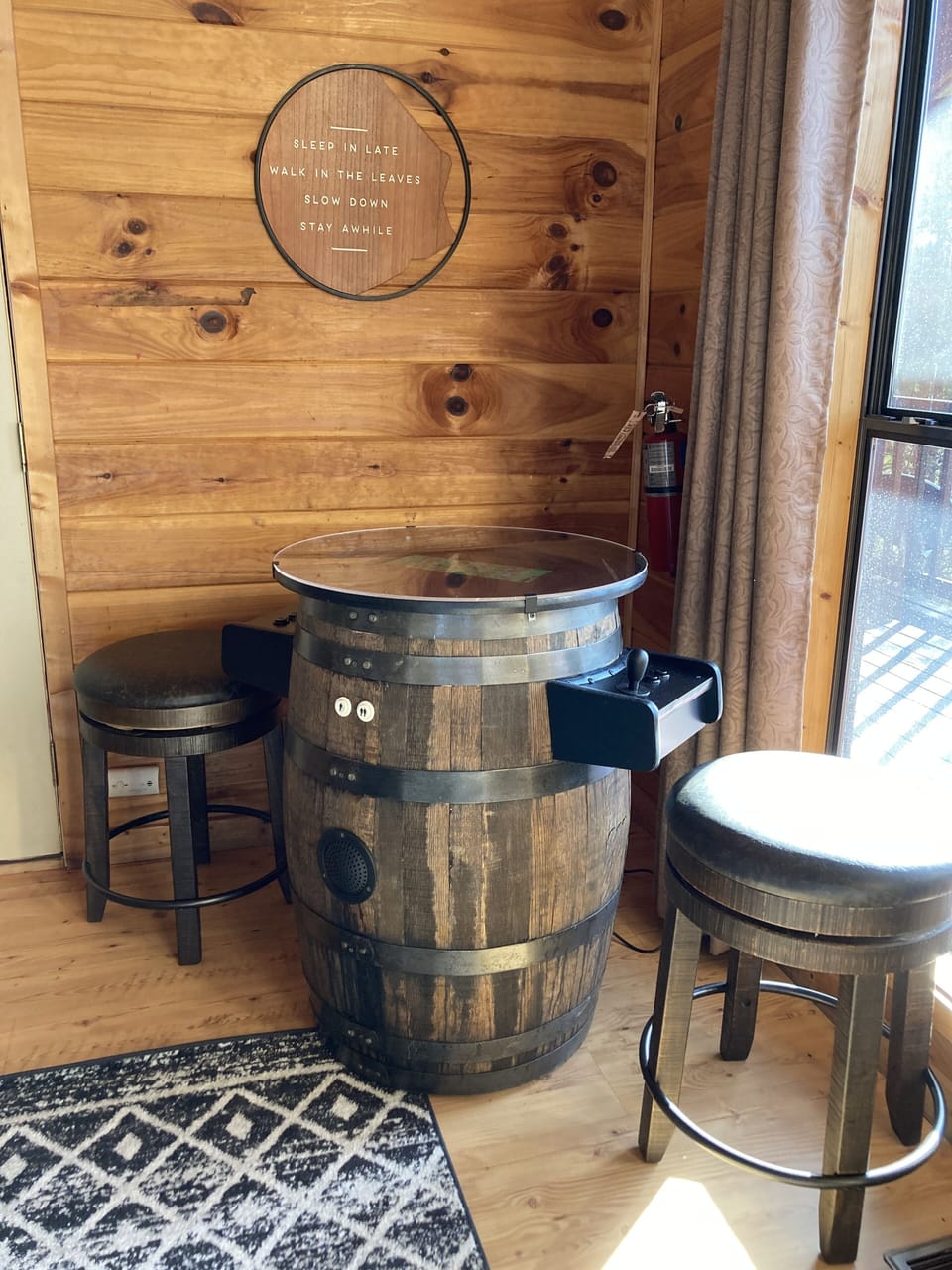 Pull up a stool and have fun with this whiskey barrel w/60 Classic arcade games.
