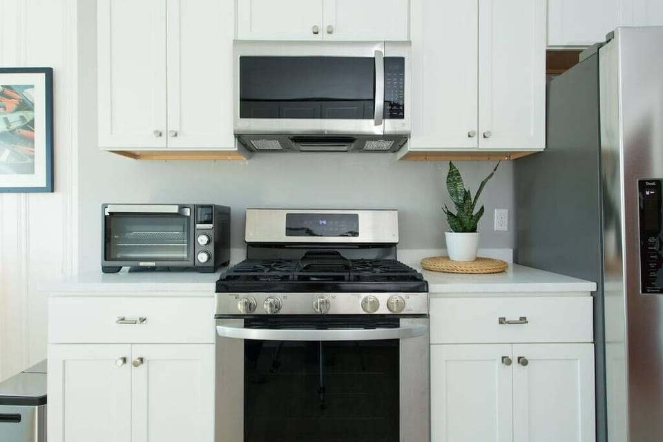 Kitchen: Modern appliances and sleek design await your culinary adventures!