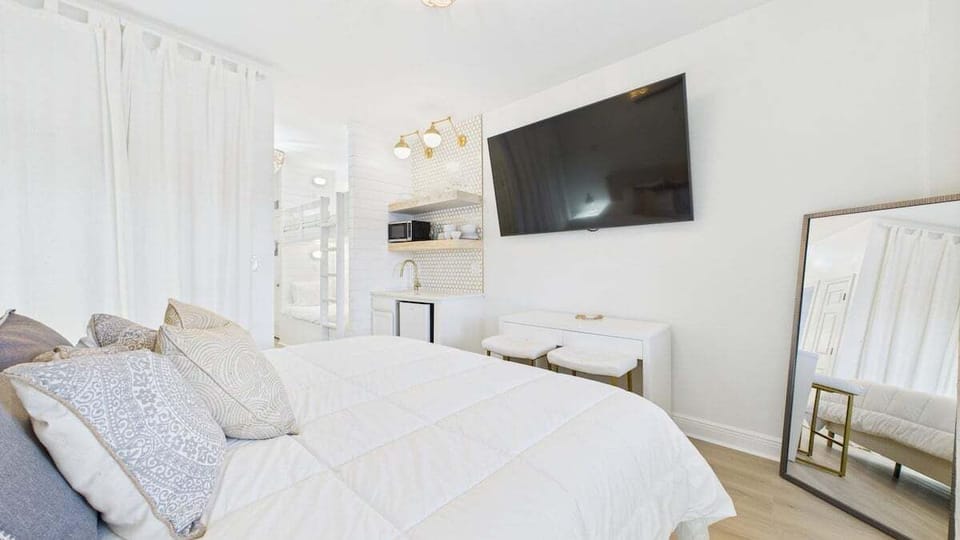 King bed and TV in living area (sleeps 2)