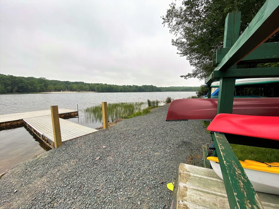 A 3-person Canoe at community beach lake