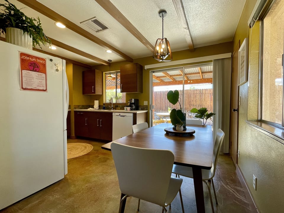 Dining area supports 6 guests (additional chairs provided)