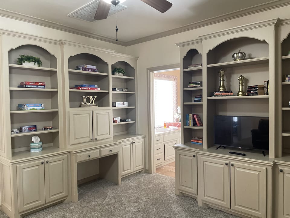 Upstairs game room includes a variety of games, puzzles & smart tv