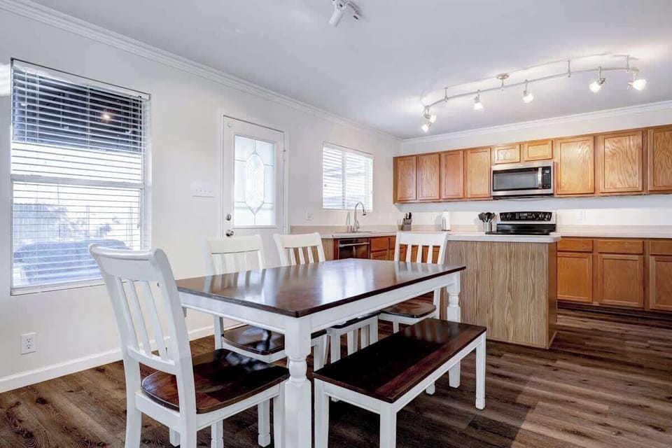 Fully stocked kitchen with additional seating for six.