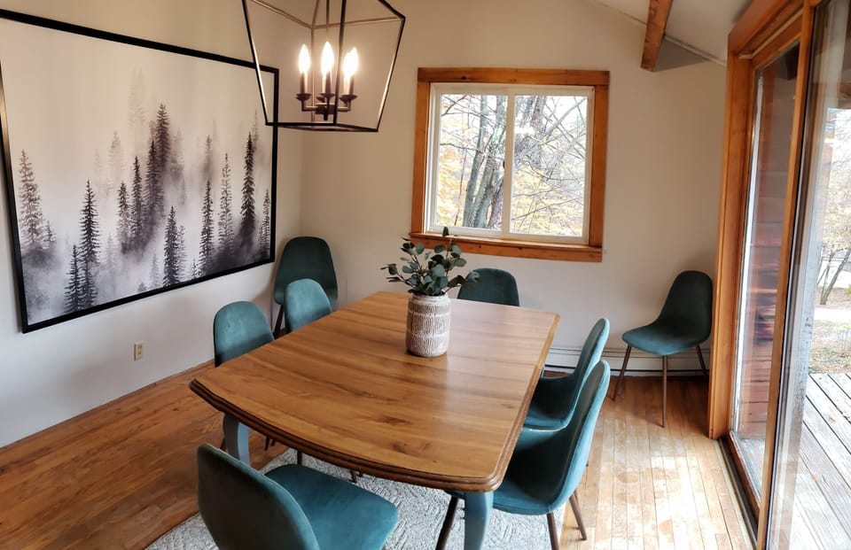 Dining room upstairs with slider door to deck.