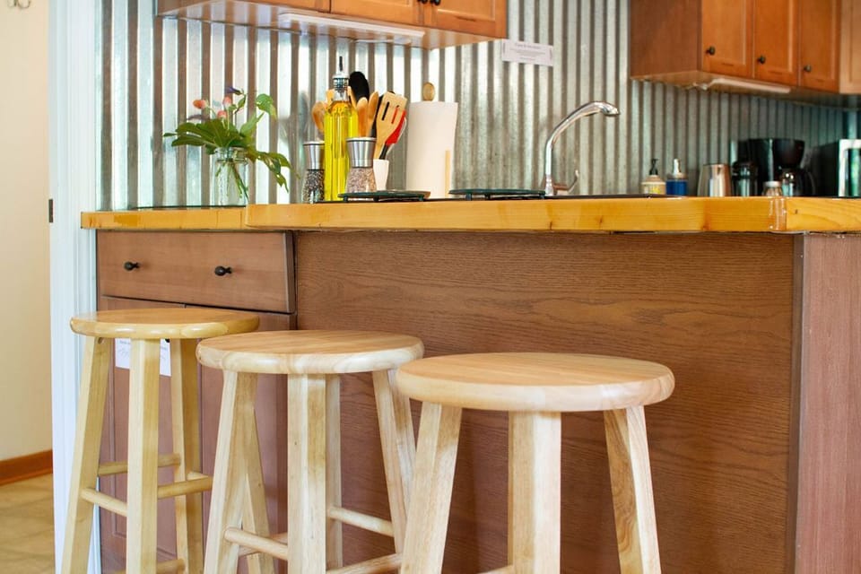 Gather round hand cut countertops.