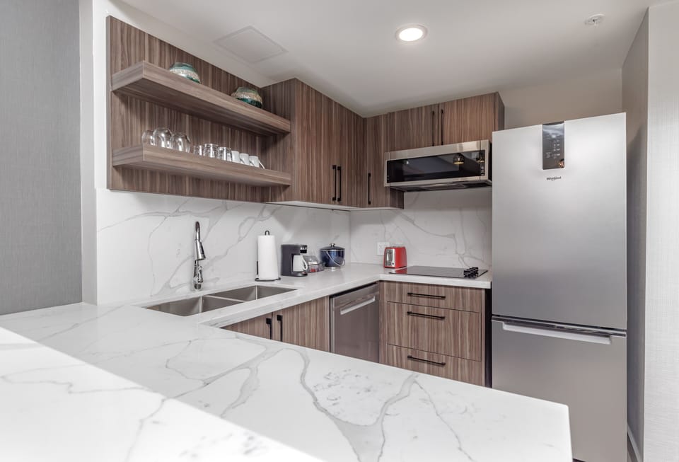 Suite, 1 King Bed with Sofa bed, Accessible (Roll-In Shower) | Private kitchen | Coffee/tea maker