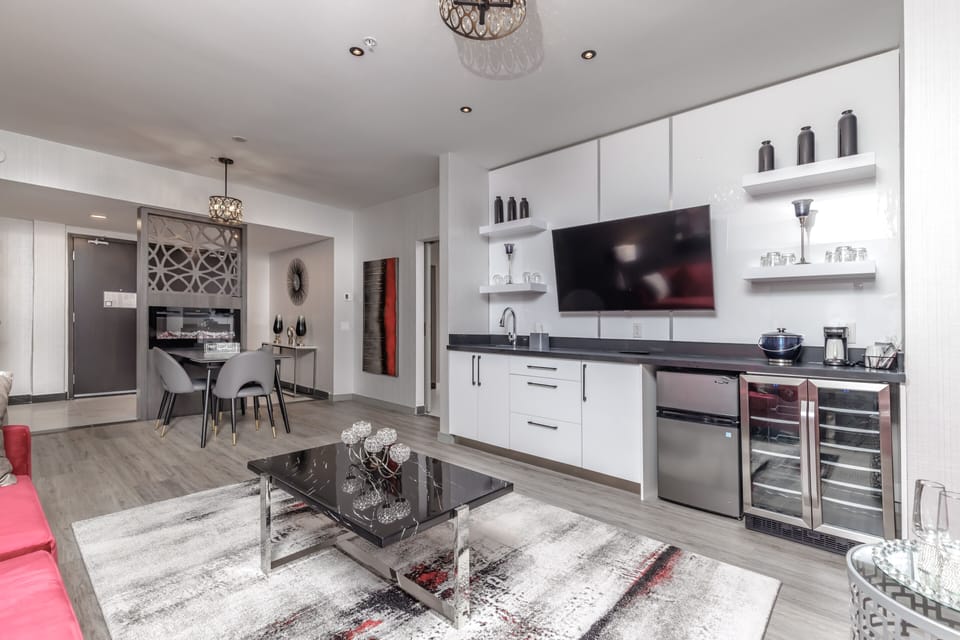 Suite, 1 King Bed with Sofa bed (Specialty) | Living area | 55-inch flat-screen TV with cable channels, TV