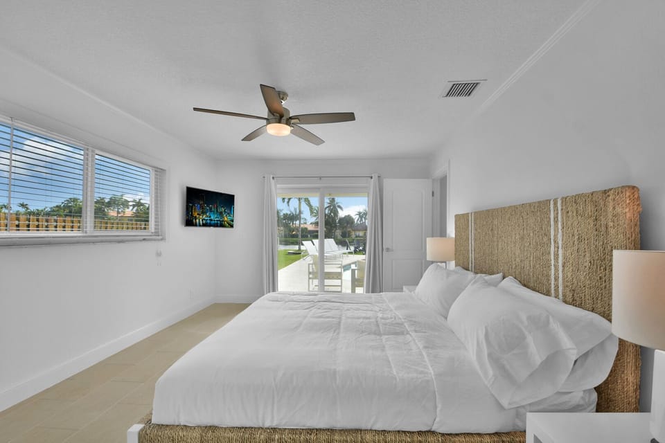 Bedroom 1 
King bed, Quality fresh linen and towels provided
En-suite 
Desk 
Ceiling fan and patio doors