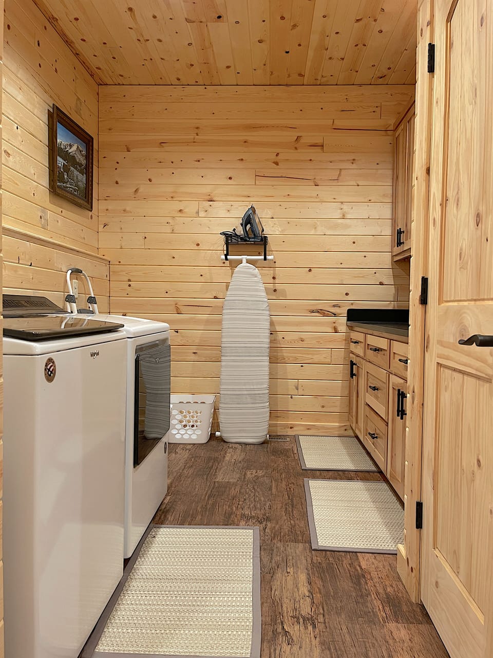 Convenient laundry area with full size washer and dryer